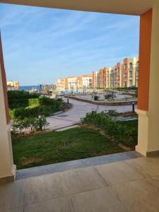 a view of the beach from a balcony of a building at Oyster Bay Marsa Alam ( Unit I5-06) in Abu Dabbab