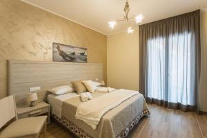 Postel nebo postele na pokoji v ubytování Oasi Perla Del Mare Rooms