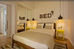 a bedroom with a large bed and a bed at 02 Design Flat in Porto Downtown in Porto
