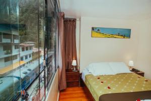 Llit o llits en una habitació de Nativus Hostel Machu Picchu