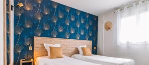 Postel nebo postele na pokoji v ubytování Hotel du Cap
