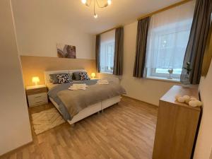 Łóżko lub łóżka w pokoju w obiekcie Apartmány Herc