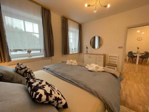 Łóżko lub łóżka w pokoju w obiekcie Apartmány Herc