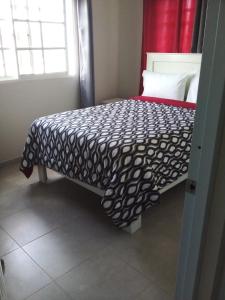 Apartahotel MACADANA客房内的一张或多张床位