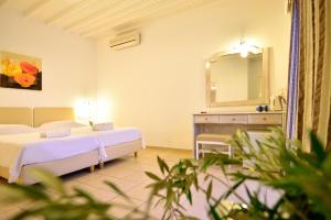 Cama ou camas em um quarto em Paolas Sunset