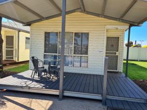 a porch with a table and chairs on a house at BIG4 Mildura Getaway in Mildura