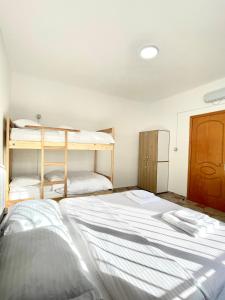 Postel nebo postele na pokoji v ubytování Me & You Hostel