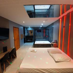 Ένα ή περισσότερα κρεβάτια σε δωμάτιο στο Desejo Motel