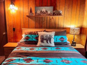 a bedroom with a bed with pillows on it at Mountain Top in Bessemer