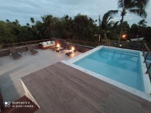 Kolam renang di atau dekat dengan Praia do Forte Ohana Residence +3 gambar