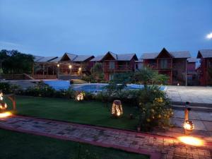 a backyard with christmas lights in the yard at Chaleville Coqueiro 1001 in Luis Correia
