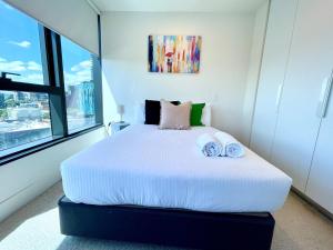 Katil atau katil-katil dalam bilik di Readyset Apartments at Vision