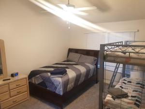 a bedroom with a bed and a ceiling fan at Somerset Villas 84 in Kissimmee