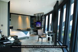 Letto o letti in una camera di JHL Solitaire Gading Serpong