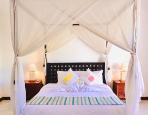 Кровать или кровати в номере Arona Villa Sanur