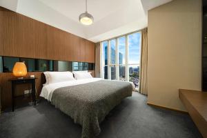 Postel nebo postele na pokoji v ubytování S6 Service Apartment（Chengdu Chunxi Road Taikoo Li Branch）