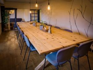 a large wooden table with chairs around it at Japan Snowsports in Iiyama
