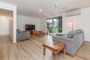 a living room with two couches and a coffee table at Lakeview on Victoria in Forster