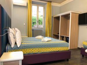 Ένα ή περισσότερα κρεβάτια σε δωμάτιο στο Hotel Gioia