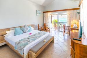 Postel nebo postele na pokoji v ubytování Le Peninsula Bay Beach Resort & Spa