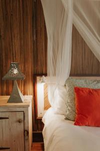 מיטה או מיטות בחדר ב-La Vieille Cheminee