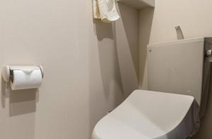 a bathroom with a toilet and a roll of toilet paper at T-BASE - Vacation STAY 21950v in Tokyo