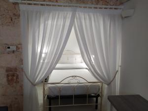 Posteľ alebo postele v izbe v ubytovaní Soggiorno Galasso