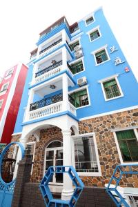 a blue and white building at Shenzhen Xichong beach Lanting Homestay in Dapengcheng