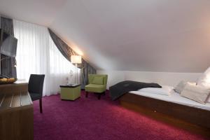Postel nebo postele na pokoji v ubytování Hotel Rössle