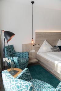 Postel nebo postele na pokoji v ubytování Hotel Rössle