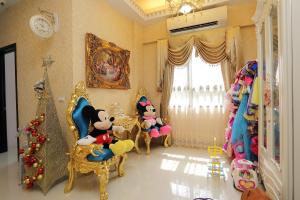 a room with a christmas tree and stuffed animals at Sophia B&B in Dongshan