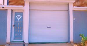 a garage door with a light on it at شاليه دانة بحر in Yanbu