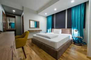 מיטה או מיטות בחדר ב-Hotel City IN