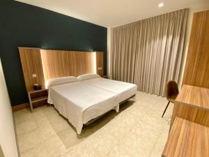 Postel nebo postele na pokoji v ubytování Hotel Camino Real
