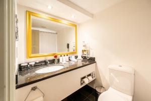a bathroom with a sink and a mirror at InterContinental Wien by IHG in Vienna