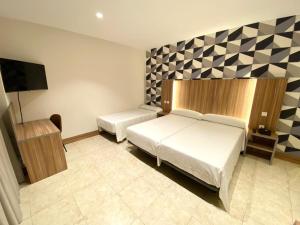 Postel nebo postele na pokoji v ubytování Hotel Camino Real