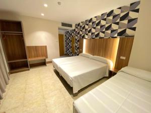 Postel nebo postele na pokoji v ubytování Hotel Camino Real