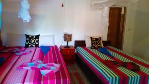 Voodi või voodid majutusasutuse Sigiriya River Side Resort toas