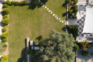 an overhead view of a yard with grass and trees at Eco Villa, a perfect escape close to the beach, By ThinkVilla in Maroulás