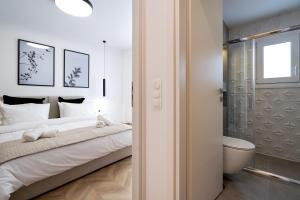 Posteľ alebo postele v izbe v ubytovaní Pagrati's best apartment