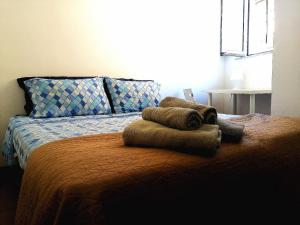 Un pat sau paturi într-o cameră la Mamma Mia Apt