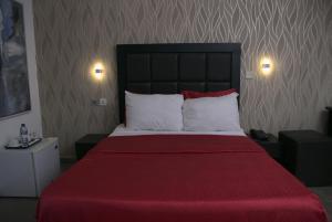 Letto o letti in una camera di Angel Hotel