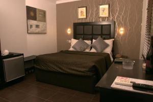 Letto o letti in una camera di Angel Hotel
