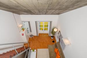 an overhead view of a living room with a ceiling at Bocage Loft (Setúbal downtown) in Setúbal