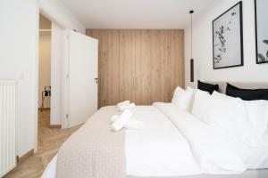 Posteľ alebo postele v izbe v ubytovaní Pagrati's best apartment