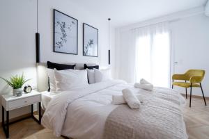 Posteľ alebo postele v izbe v ubytovaní Pagrati's best apartment