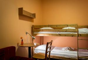 Rúm í herbergi á Relax hotel Bára Benecko