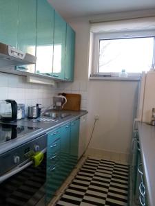 Kuchyňa alebo kuchynka v ubytovaní Apartament BB Źródlana