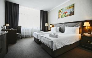 Cama o camas de una habitación en SK Royal Hotel Tula