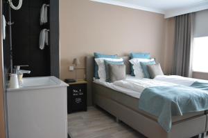 Postel nebo postele na pokoji v ubytování Hotel De Kalvaar